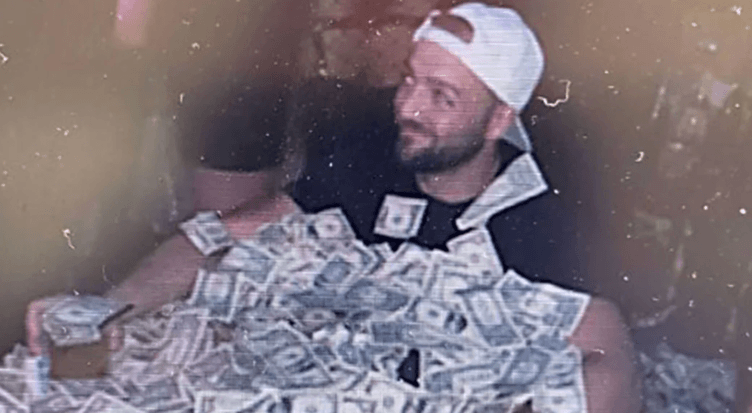 Man Who Posed in Bathtub Filled with Cash Pleads Guilty to Stealing Bitcoin